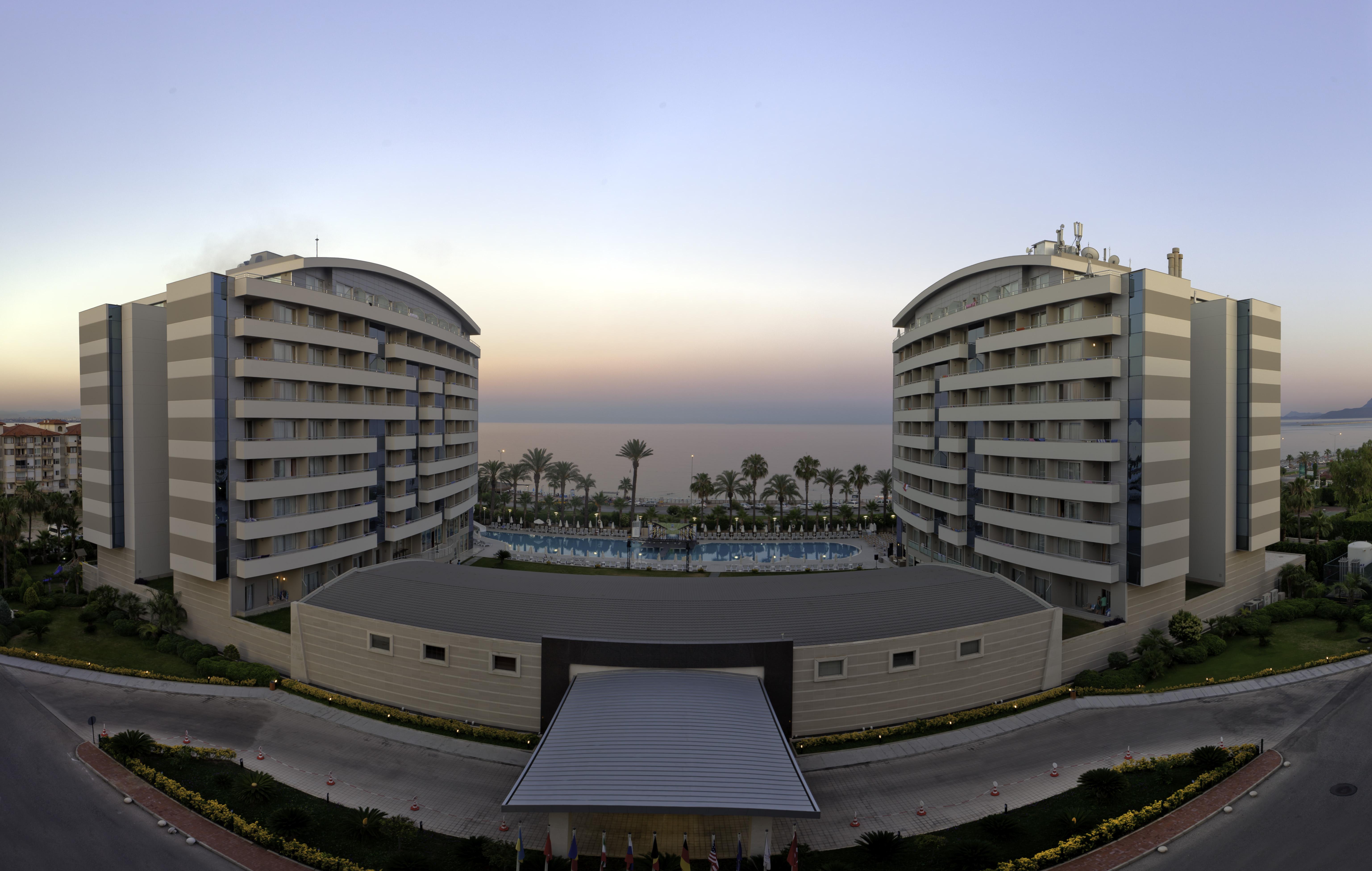 Porto Bello Hotel Resort & Spa Antalya Exterior photo The hotel at sunset